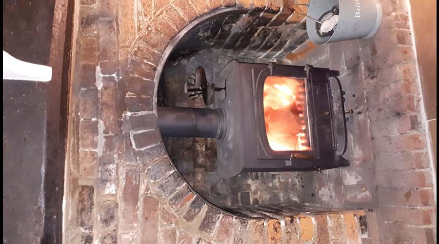 Log and coal burning stove in the lounge