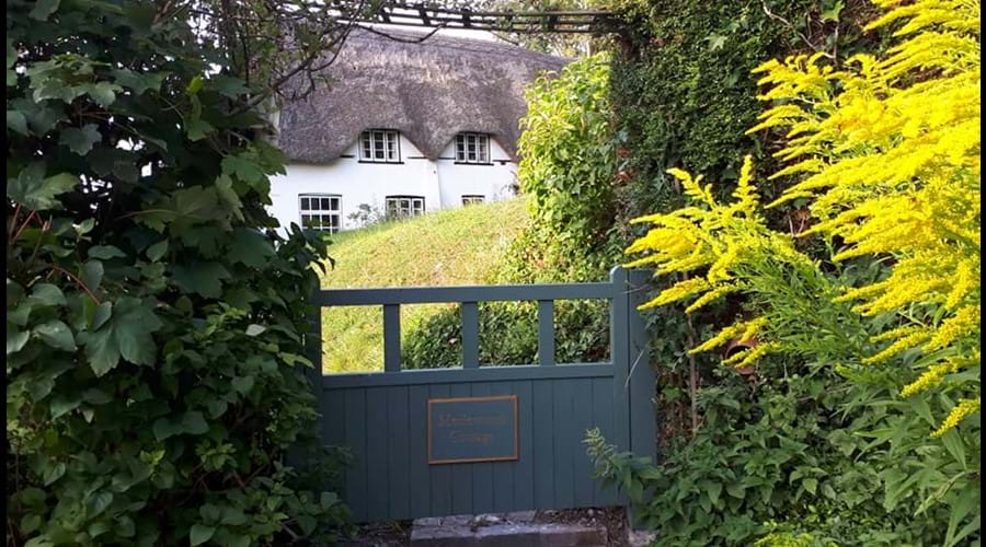 View of cottage through the front gate