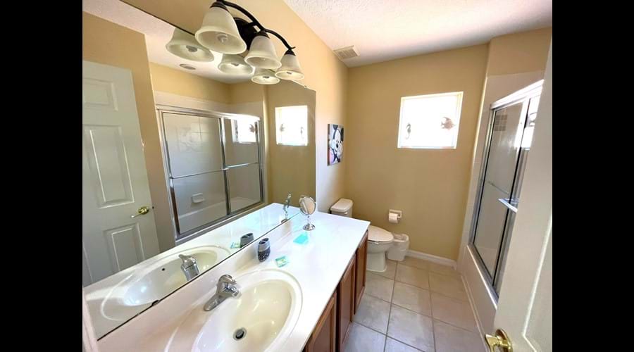 1st floor Family Bathroom with shower over bath