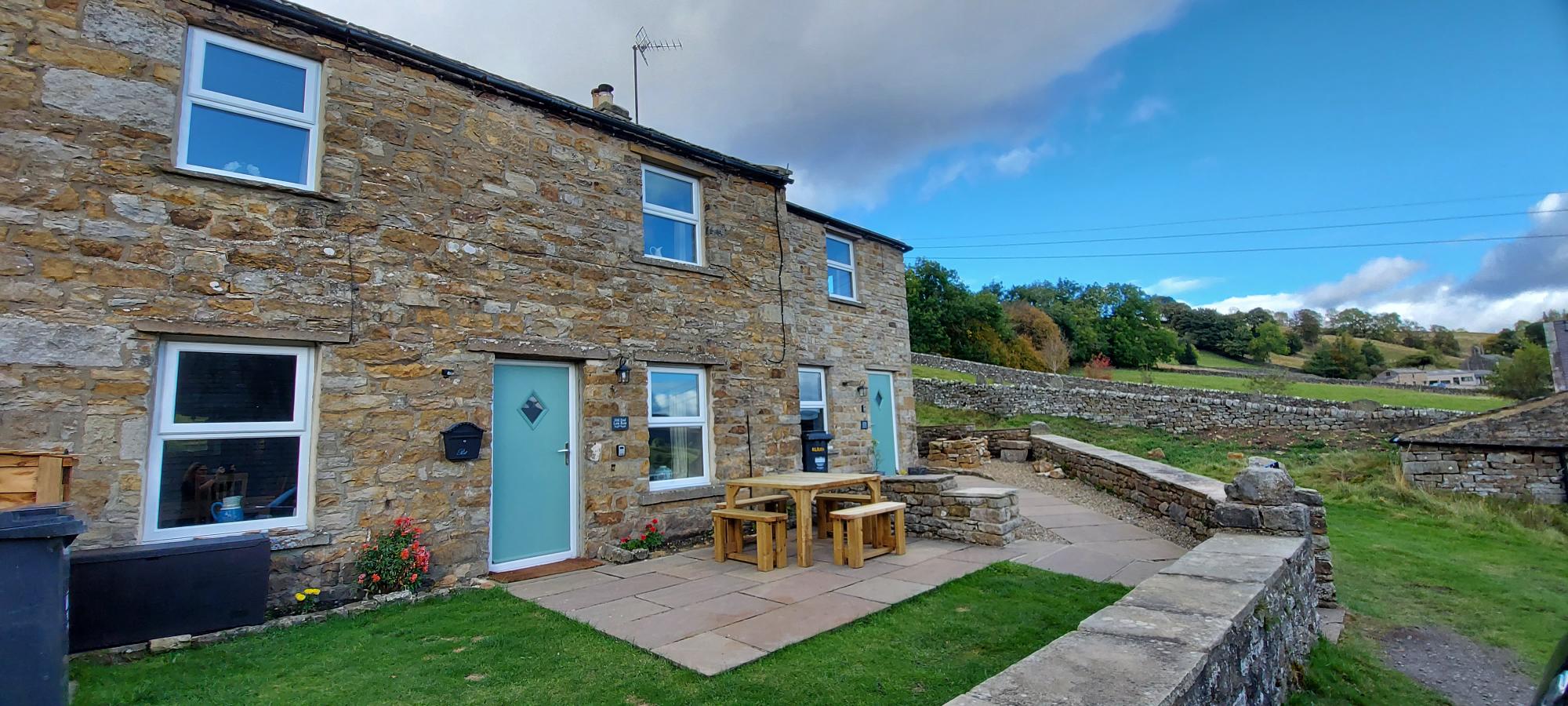 Outside the cottage to the left showing stunning views