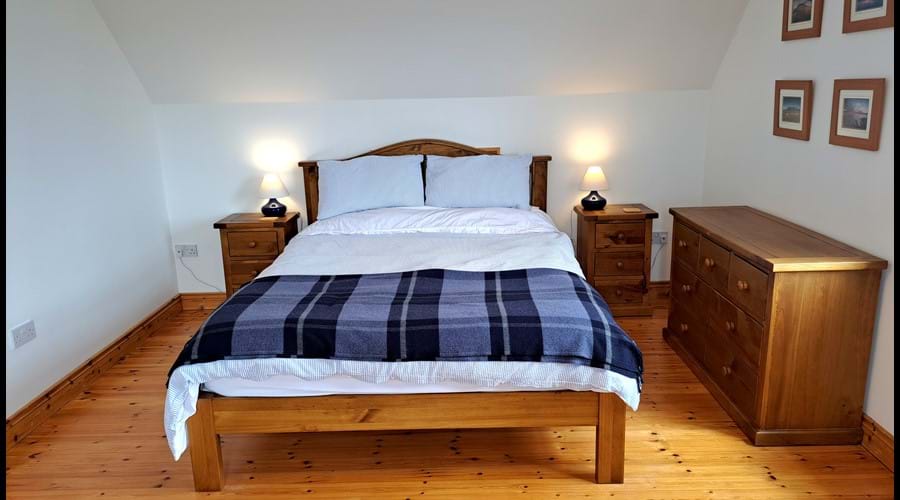 The kingsize bed in the second upstairs bedroom