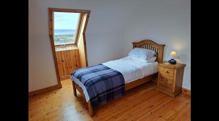 The single bed in the second upstairs bedroom