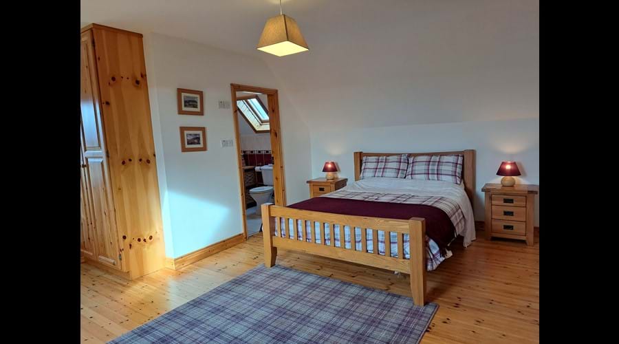 The kingsize bed in the master bedroom