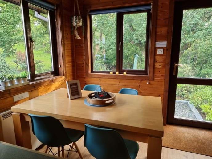 Seating for 4 in our kitchen with woodland views.