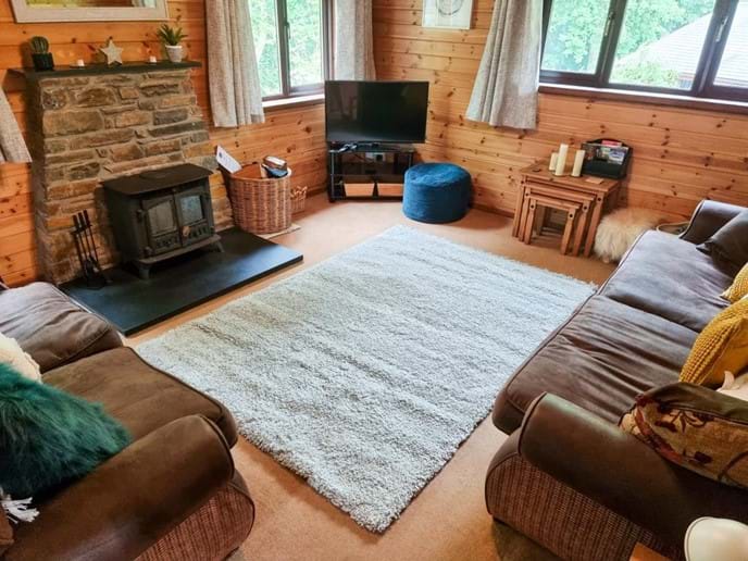 Spacious and comfortable front room with log burner and smart TV