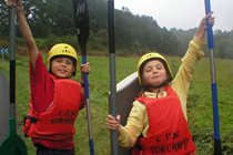 2 youngsters enjoying an outing to the kayaking centre at nearby Torchamps