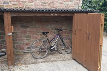 Securable bike storage inc anchor and outside locking