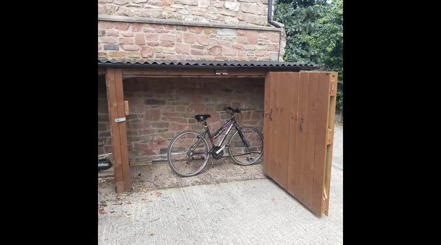 Securable bike storage inc anchor and outside locking