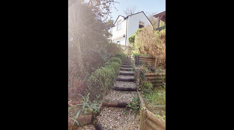 Lower garden area with pond, lower patio area and secret garden