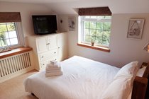 Main bedroom with dual aspect of country views