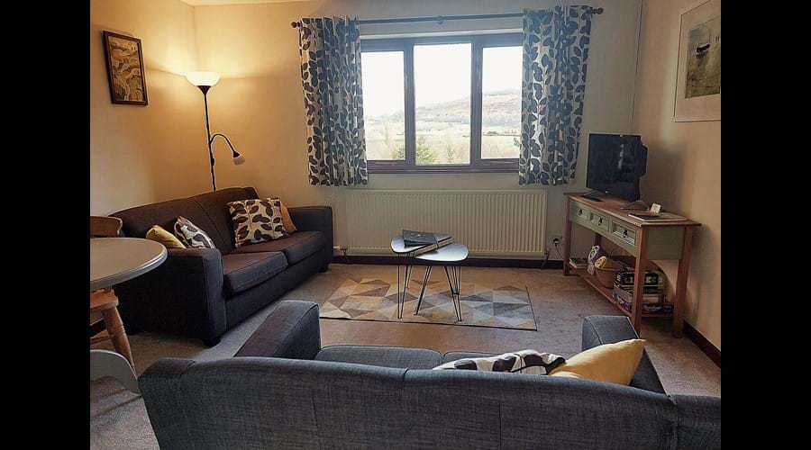 Living area Bright dual aspect lounge with far-reaching valley views