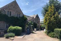The Old Court serves an extensive menu and has a lovely sun-trap rear garden and cosy bar with fire
