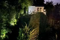 Upper garden summerhouse at dusk