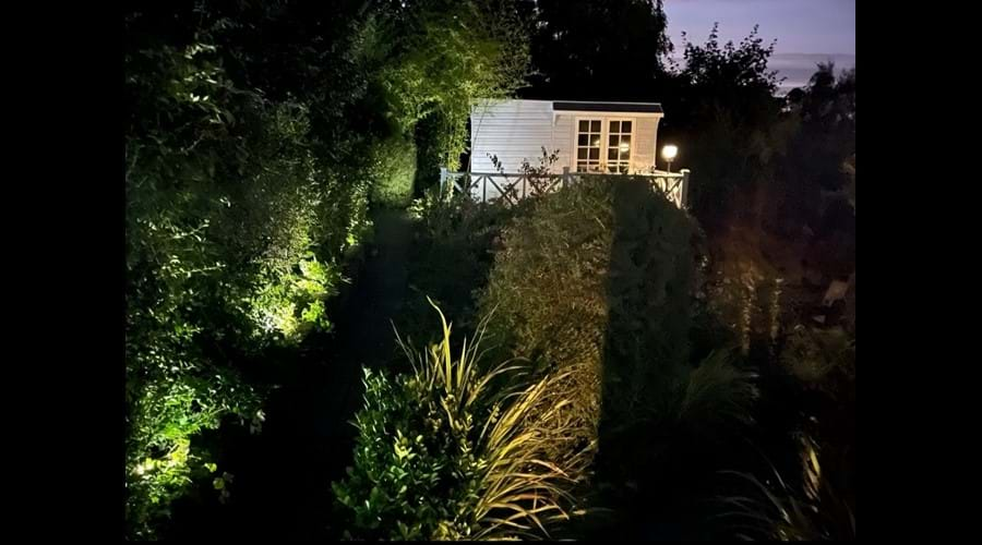 Upper garden summerhouse at dusk