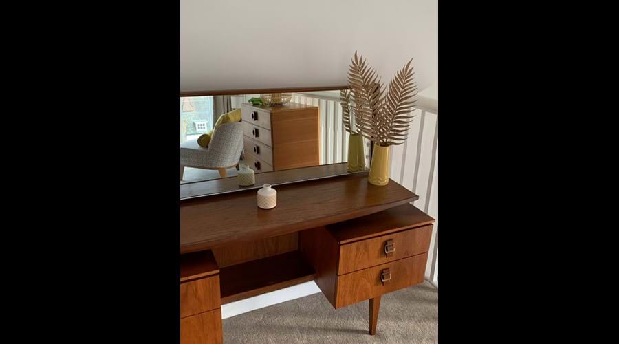 Stylish mid-century furniture blends perfectly in the Minster room