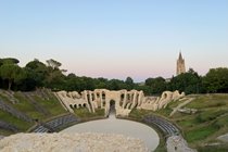 Explore the Roman Amphitheatre at Saintes, where a restoration project has commenced. Abbaye aux Dames stands tall in the background