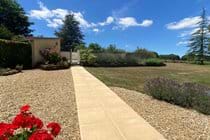 Garden path leads from the terrace to the private, sheltered, heated pool area in sunshine all day
