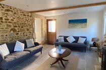 Triple aspect sitting room benefitting from French doors opening onto the loggia and garden beyond