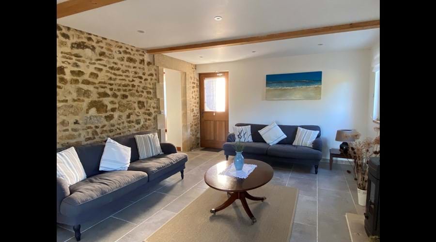 Triple aspect sitting room benefitting from French doors opening onto the loggia and garden beyond