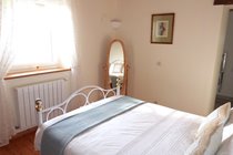 Bright, sunny Master Bedroom overlooking the garden, stream, pool and farmer