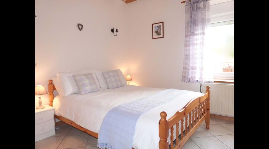 Downstairs double bedroom with wardrobe and chest of drawers