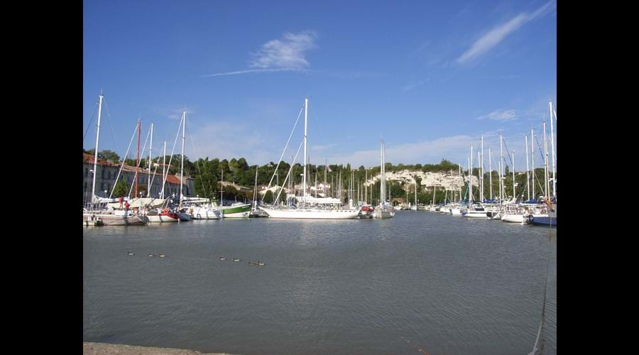 The pretty port of Mortagne sur Gironde with restaurants along the quay offering the local freshly caught fish