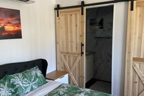 Bedroom West Wing Apartment-separate bathroom and toilet with barn doors