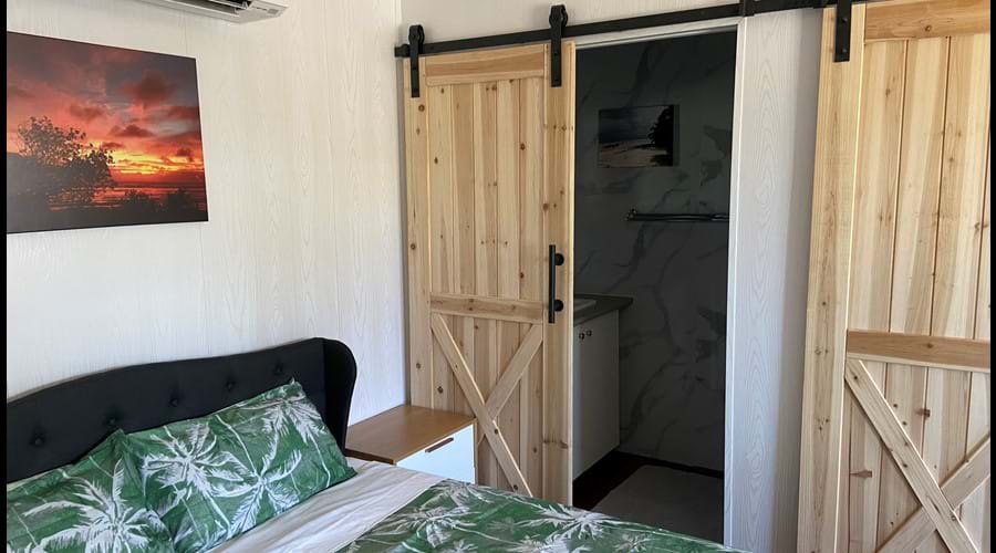 Bedroom West Wing Apartment-separate bathroom and toilet with barn doors