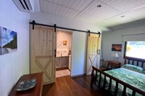Bedroom North Wing Apartment-separate bathroom and toilet with barn doors