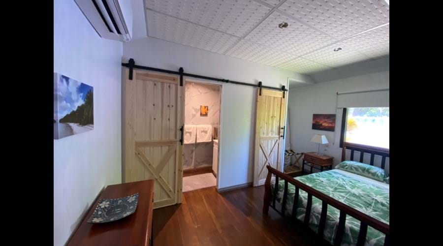 Bedroom North Wing Apartment-separate bathroom and toilet with barn doors