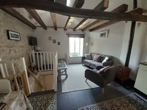living area - showing stairs to downstairs bedroom
