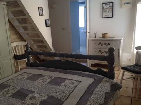 Bedroom, with bathroom leading off it