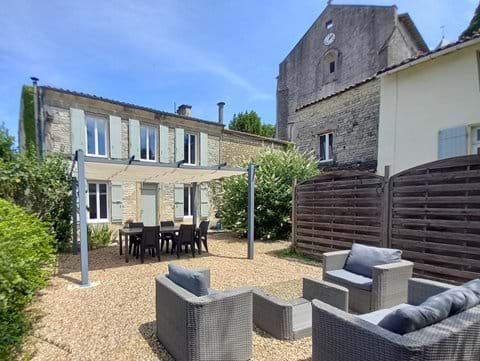 Farmhouse with outside dining & lounging areas