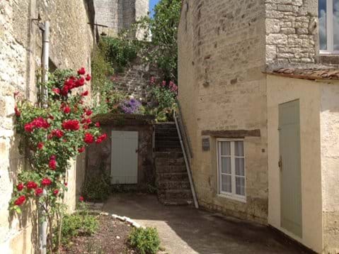 Fig Tree Cottage (right) with stairs leading up to the terrace & front door