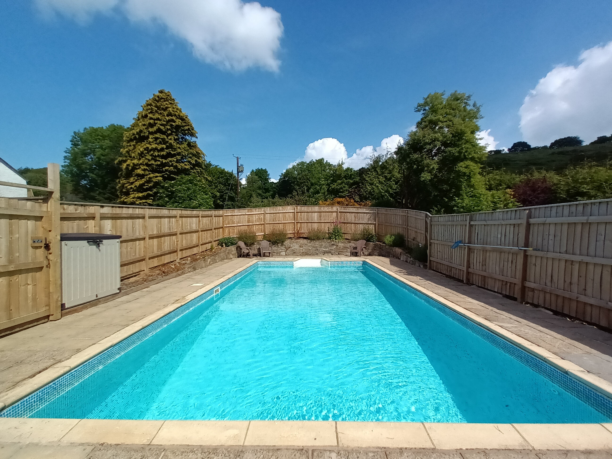 Outdoor heated swimming pool at Lower Hearson