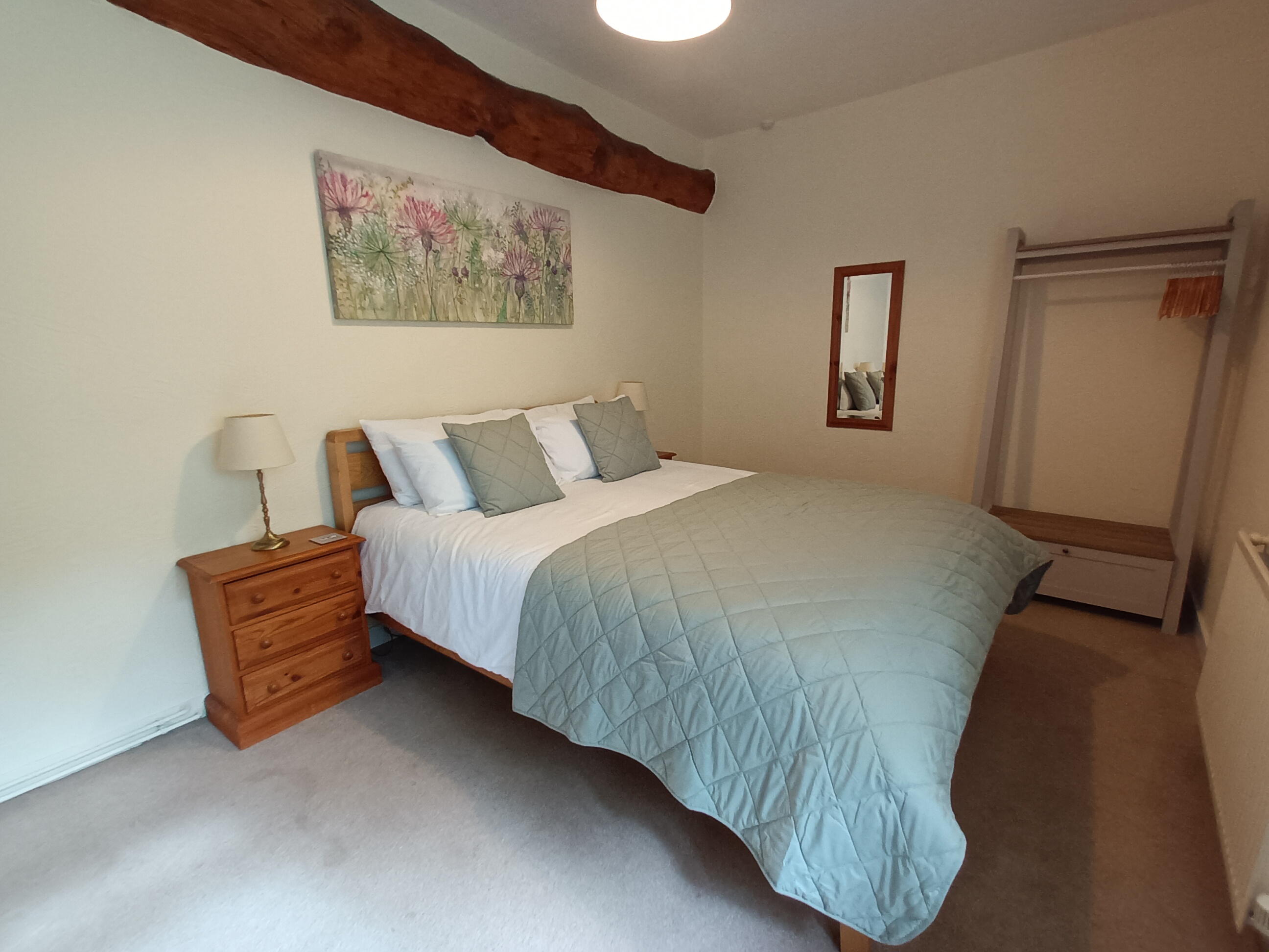 Spacious bedroom with king size bed