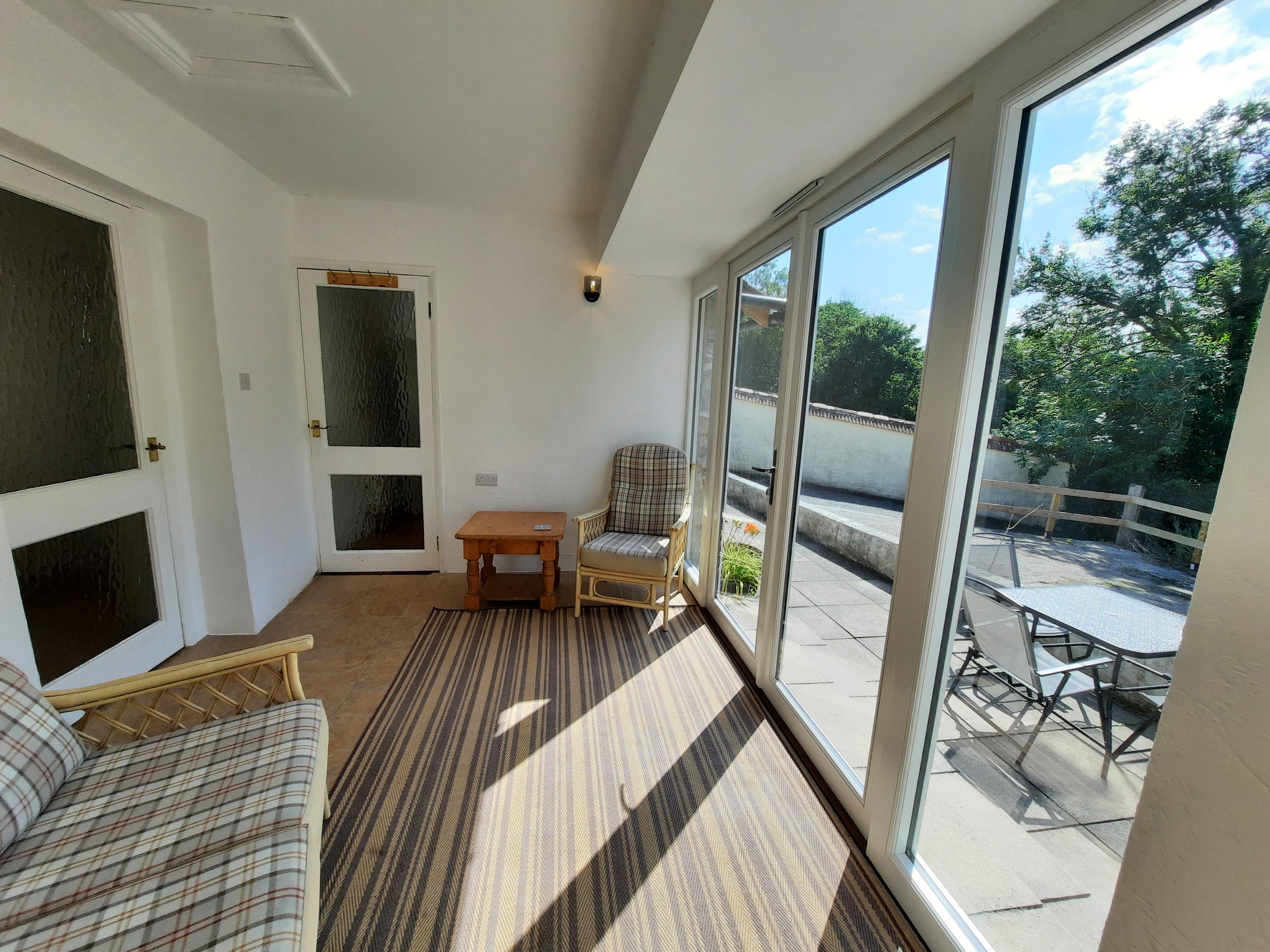 The new French doors make this a lovely space whatever the weather