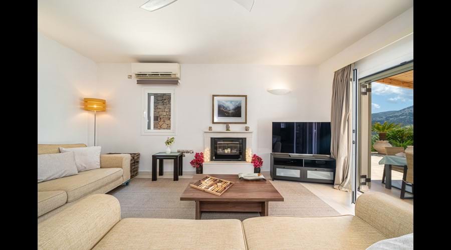 lounge and seating area with TV and view Photo