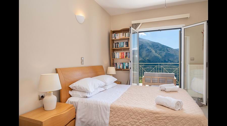 main bedroom with stunning view and balcony Photo