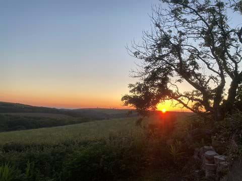 Sunset View over Coombe Valley and Duckpool from rhe lodge patio