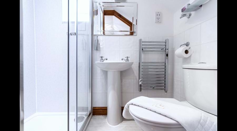 Walk-in shower and heated towel rail in upstairs en-suite bathroom
