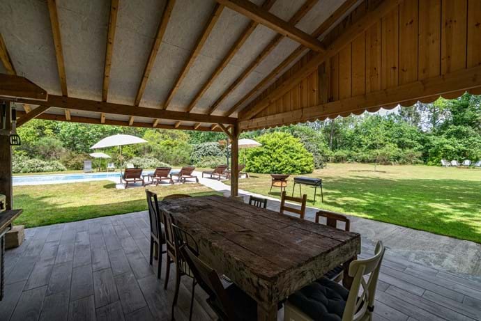 Covered outside eating area with summer kitchen.