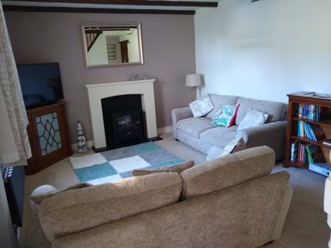 Cosy lounge with smart TV - looks out onto garden