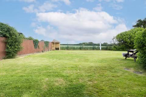 A safe, private garden awaits beyond the patio doors — ideal for relaxing, playing, or dining al fresco.