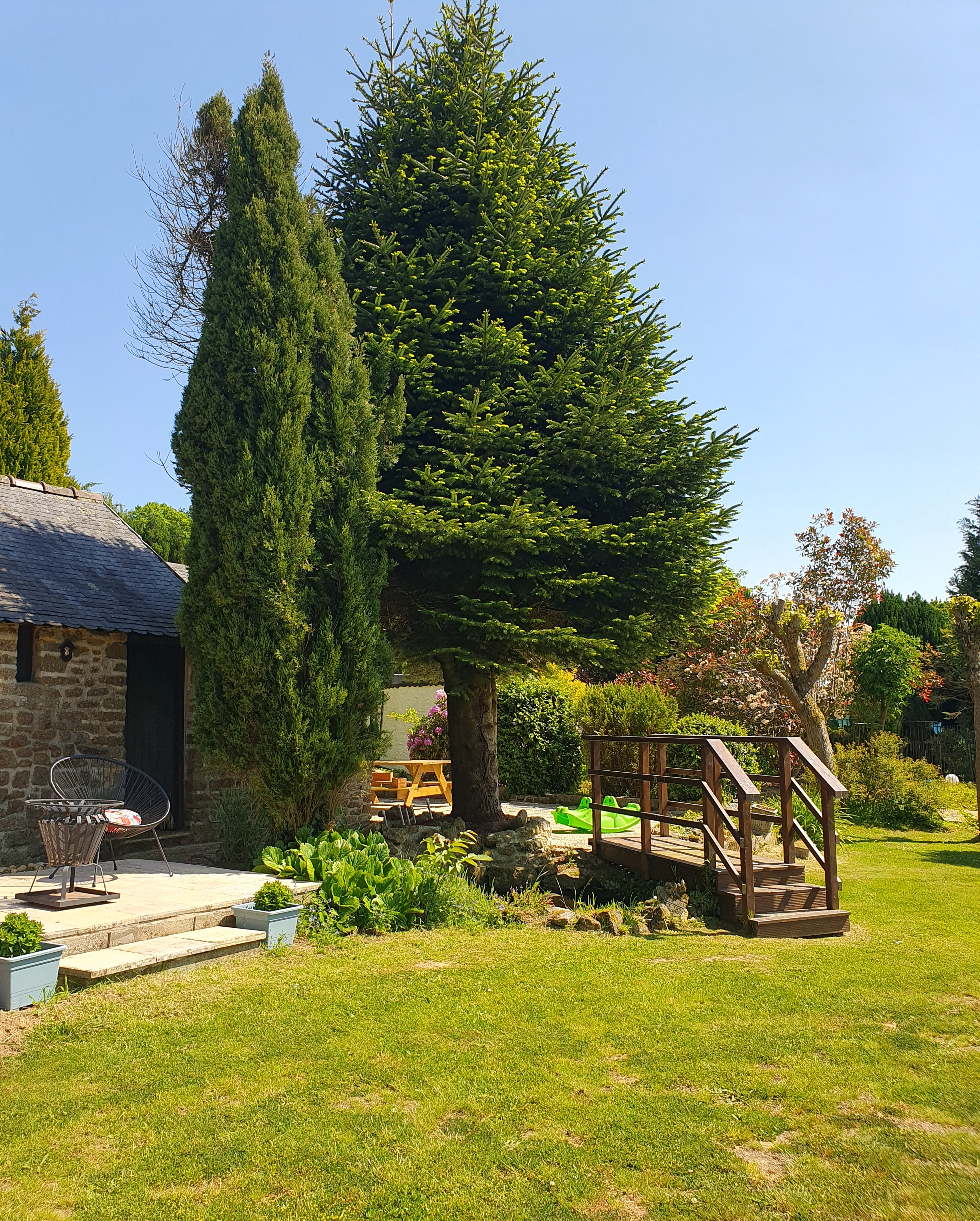 Bridge over pond to communal terrace
