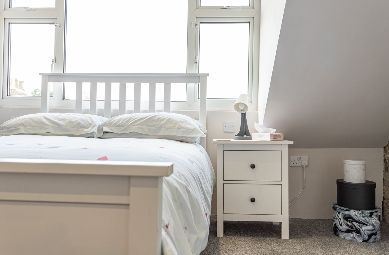 Double bedroom with period features in Victorian Dorset cottage.