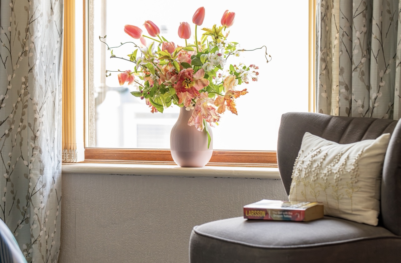 King bedroom with period features in Victorian Dorset cottage.