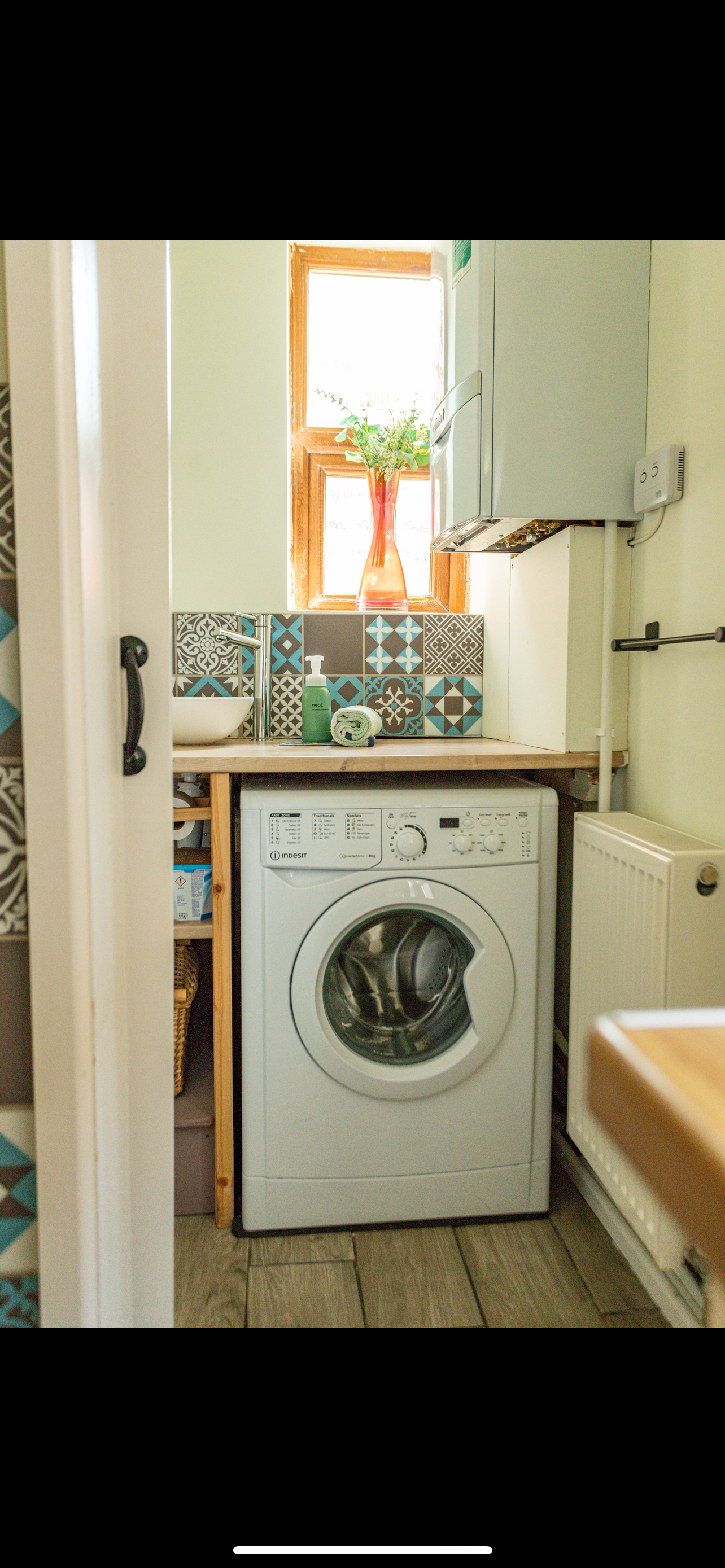 Practical utility area with washing machine and WC in our Portland holiday cottage