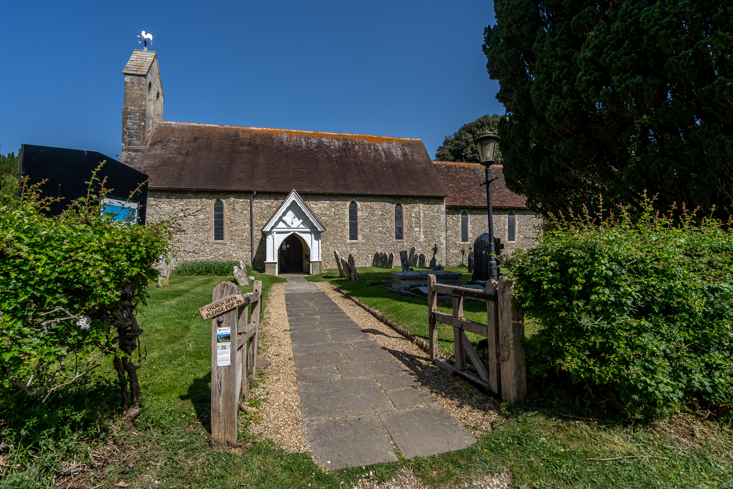 Photo of the historic Chidham church near Canute Cottages, a picturesque village church surrounded by countryside