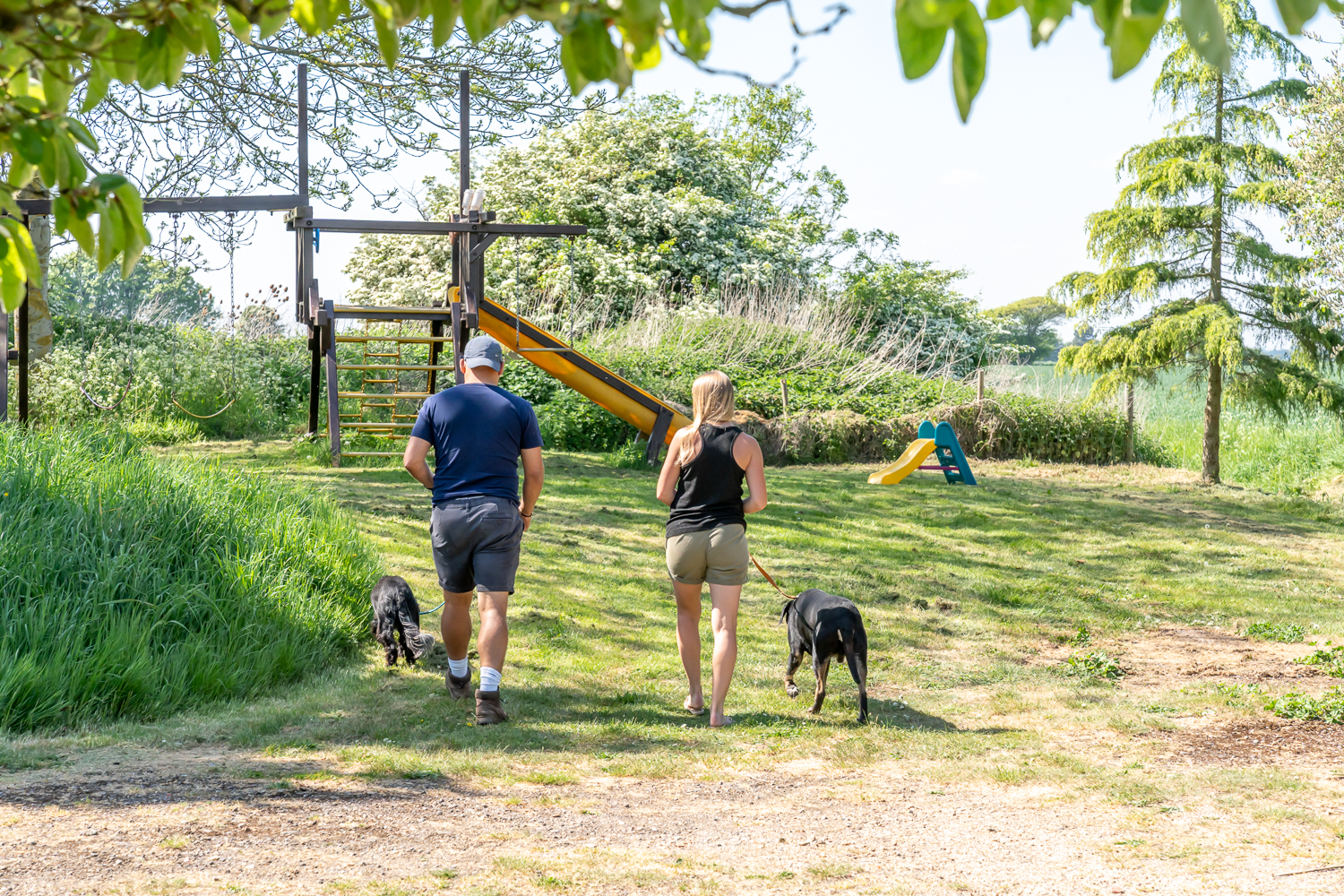 Children’s outdoor play area at Canute Cottages featuring safe, family-friendly equipment